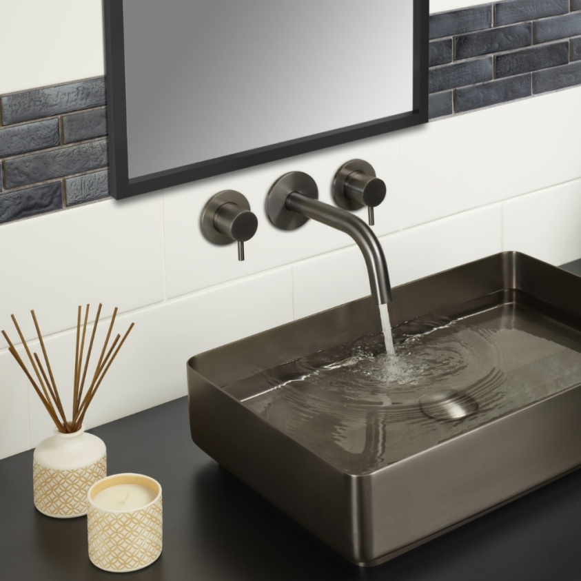 Product Lifestyle image of the JTP Vos Brushed Black Bath/Basin Spout paired with Vos Brushed Black Wall Valves